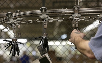 In this Monday, April 16, 2018, photo SKILCRAFT government pens are prepared transported by machinery through the production line at the Industries of the Blind in Greensboro, N.C. Image credit:AP Photo/Gerry Broome