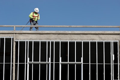 In this Oct. 6, 2017, file photo, workers build an apartment and retail complex in Nashville, Tenn. Image credit: AP Photo/Mark Humphrey, File