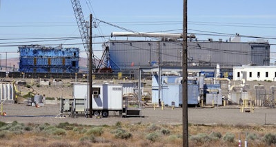 This May 13, 2017, photo shows a portion of the Plutonium Finishing Plant on the Hanford Nuclear Reservation near Richland, Wash. Officials say dozens of workers demolishing the 1940s-era plutonium processing plant there have ingested or inhaled radioactive particles in the past year, prompting a halt to the demolition of the plant until a safe plan can be developed. (AP Photo/Nicholas K. Geranios)