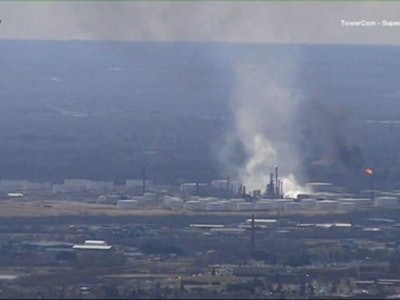 This image from video provided by WDIO-TV in Duluth shows smoke rising from the Husky Energy oil refinery after an explosion Thursday morning, April 26, 2018 in Superior, Wis. Authorities say several people were injured in the explosion. (WDIO-TV via AP)