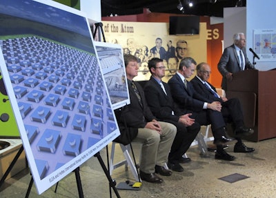 In this April 29, 2015, file photo, an illustration depicts a planned interim storage facility for spent nuclear fuel in southeastern New Mexico as officials announce plans to pursue the project during a news conference at the National Museum of Nuclear Science and History in Albuquerque, N.M. Image credit: AP Photo/Susan Montoya Bryan, File