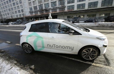 In this Tuesday, Jan. 10, 2017, file photo, an autonomous vehicle is driven by an engineer on a street in an industrial park in Boston. Image credit: AP Photo/Steven Senne, File
