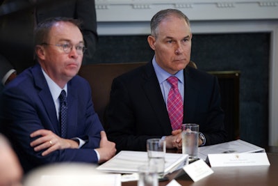 Director of the Office of Management and Budget Mick Mulvaney, left, and Environmental Protection Agency administrator Scott Pruitt listen to President Donald Trump speak during a cabinet meeting at the White House, Wednesday, May 9, 2018, in Washington. Image credit: AP Photo/Evan Vucci