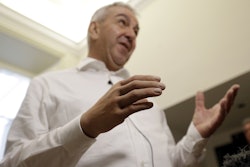 Marco Zambelli wears his prosthetic hand during an interview with the Associated Press in Rome Thursday, May 10, 2018. Image credit: AP Photo/Gregorio Borgia