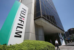 People walk out of Nishiazabu headquarters of Fujifilm Holdings Corporation in Tokyo, Monday, May 14, 2018. Image credit: AP Photo/Koji Sasahara