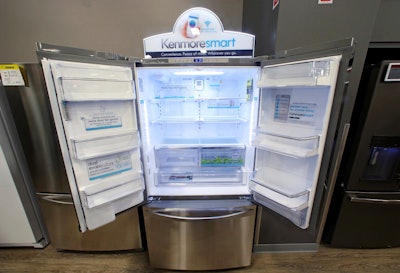 In this July 20, 2017, file photo, the Kenmore Elite Smart French Door Refrigerator appears on display at a Sears store in West Jordan, Utah. In a move announced Monday, May 14, Sears Holdings Corp. says a special committee of its board is starting a formal process to explore the sale of its Kenmore brand and related assets. Image credit: AP Photo/Rick Bowmer, File