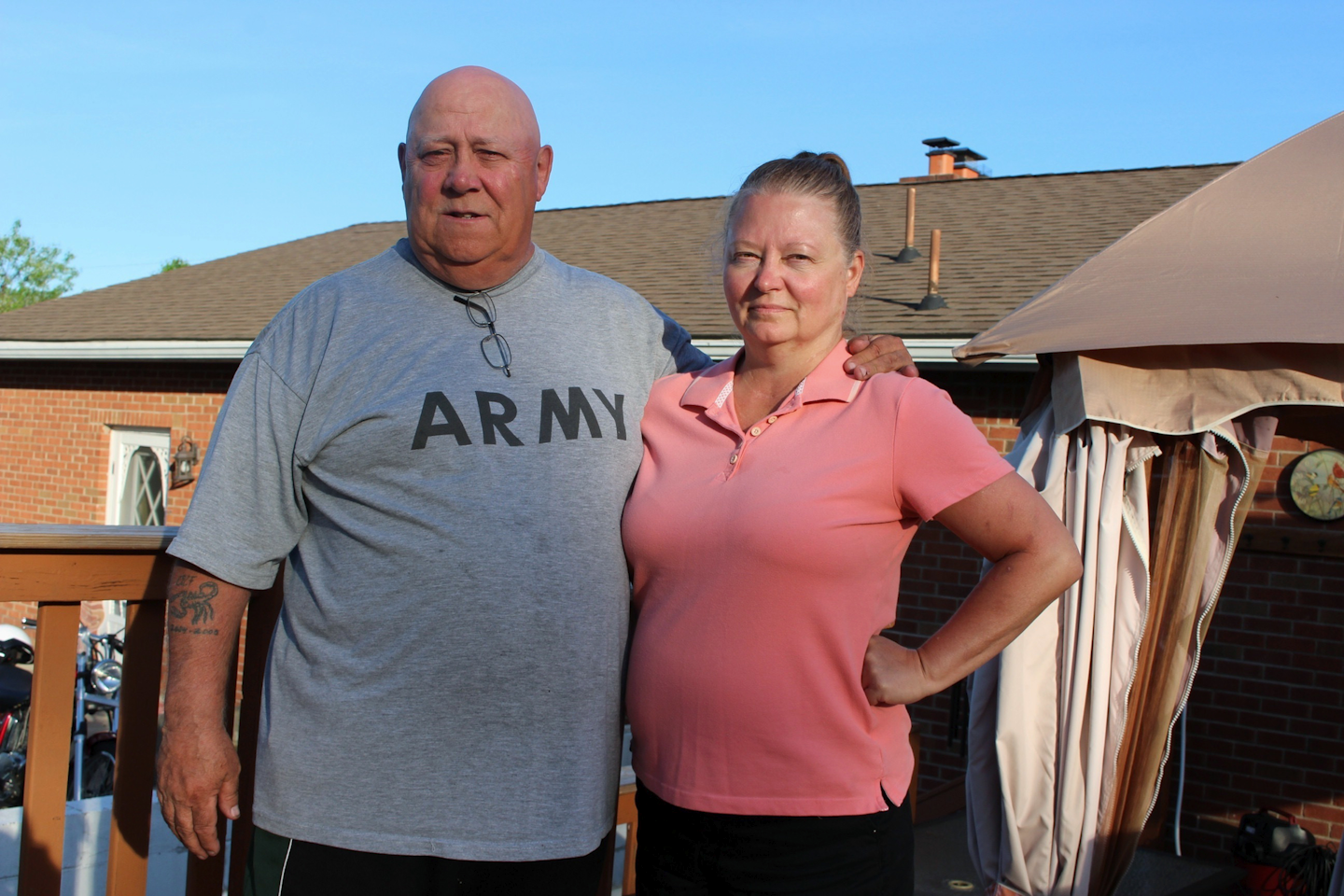 In this May 21, 2018 photo, Kip and Angela McCabe pose for a photo at their home in Berwick, Pa. The McCabes and other residents who complain about foul smells from a nearby industrial hog farm have taken their fight to the Pennsylvania Supreme Court. (AP Photo/Michael Rubinkam)