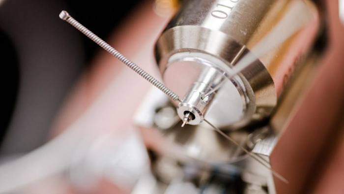 The diamond-tipped probe Herbert and Hackney use for their research is incredibly sensitive and must be housed in a compartment that muffles any sort of vibrations. Image credit: Sarah Bird/Michigan Tech
