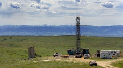 In this June 20, 2007 file photo, a natural gas drilling rig is seen outside of Wyarno, Wyo. Restrictions on drilling could be eased under a proposal from the Trump administration that would revise conservation plans for greater sage grouse, which have been in decline across much of the American West. (AP Photo/Jordan Edgcomb, File)