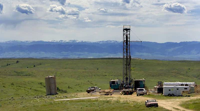 In this June 20, 2007 file photo, a natural gas drilling rig is seen outside of Wyarno, Wyo. Restrictions on drilling could be eased under a proposal from the Trump administration that would revise conservation plans for greater sage grouse, which have been in decline across much of the American West. (AP Photo/Jordan Edgcomb, File)