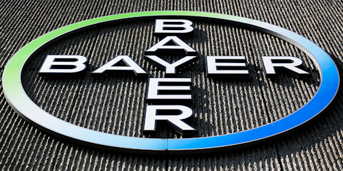 FILE - This Monday, May 23, 2016, file photo, shows the Bayer AG corporate logo displayed on a building of the German drug and chemicals company in Berlin. The German pharmaceutical giant has agreed, Tuesday, May 29, 2018, to the U.S. government's demand that it sell about $9 billion in agriculture businesses as condition for acquiring Monsanto Co., a U.S. seed and weed-killer maker. Antitrust regulators at the Justice Department say it's the biggest divestiture ever required for a merger. (AP Photo/Markus Schreiber, File)