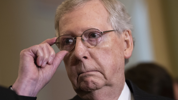 Senate Majority Leader Mitch McConnell, R-Ky., tells reporters he intends to cancel the traditional August recess and keep the Senate in session to deal with backlogged tasks, on Capitol Hill in Washington, Tuesday, June 5, 2018. Image credit: AP Photo/J. Scott Applewhite