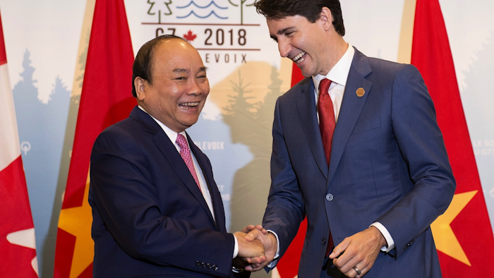 Prime Minister Justin Trudeau, right, meets with the Prime Minister of Vietnam, Nguyen Xuan Phuc, during a bilateral meeting as part of the G7, Sunday, June 10, 2018 in Quebec City. Image credit: Jacques Boissinot/The Canadian Press via AP