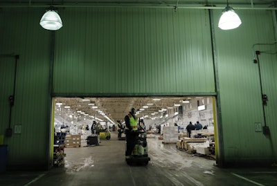 A forklift driver makes his way to the loading dock to move an order of seafood onto a truck at the New Fulton Fish Market in New York on Monday, Jan. 8, 2018. Image credit: AP Photo/Julie Jacobson