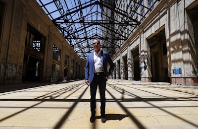 In this Thursday, June 14, 2018 photo, Bill Ford Jr., Ford Motor Company Executive Chairman and Chairman of the Board, poses in the Michigan Central Station in Detroit. Image credit: AP Photo/Paul Sancya