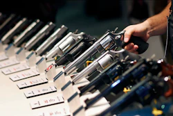 In this Jan. 19, 2016, file photo, handguns are displayed at a trade show in Las Vegas. Image credit: AP Photo/John Locher, File