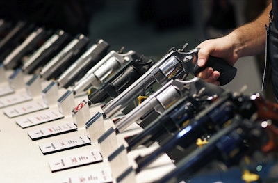 In this Jan. 19, 2016, file photo, handguns are displayed at a trade show in Las Vegas. Image credit: AP Photo/John Locher, File