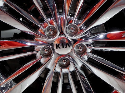 This April 1, 2015, file photo shows a wheel of the 2016 Kia Optima on display at the New York International Auto Show. Image credit: AP Photo/Mark Lennihan, File