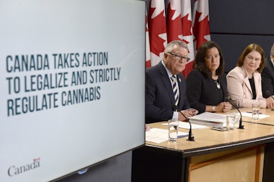 In this April 13, 2017 file photo, Minister of Public Safety and Emergency Preparedness Ralph Goodale, left to right, Justice Minister and Attorney General of Canada Jody Wilson-Raybould, and Health Minister Jane Philpott announce changes regarding the legalization of marijuana during a news conference in Ottawa, Canada. Image credit: Adrian Wyld/The Canadian Press via AP, File