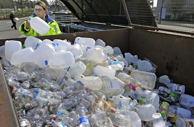 In this March 12, 2018, file photo, Skagit County Solid Waste Division manager Margo Gillaspy displays some of the recyclable plastic items that had been deposited at the Skagit County Transfer Station at Ovenell Road in Mt. Vernon, Wash. Image credit: Scott Terrell/Skagit Valley Herald via AP, File