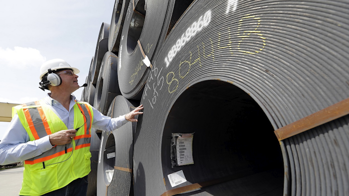 CEO Joel Johnson checks the details on a roll of steel at the Borusan Mannesmann Pipe manufacturing facility Tuesday, June 5, 2018, in Baytown, Texas.Image credit: AP Photo/David J. Phillip