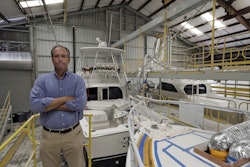 Peter Truslow, Chief Executive Officer for Bertram, a boat building company, poses near three of his custom made boats Friday, June 22, 2018, in Tampa, Fla. Image credit: AP Photo/Chris O'Meara