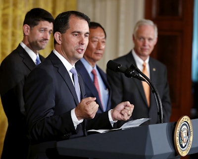In this July 26, 2017, file photo, Wisconsin Gov. Scott Walker speaks in the East Room accompanied by House Speaker Paul Ryan of Wisconsin, left, Foxconn CEO and founder Terry Gou, and Sen. Ron Johnson, R-Wis., at the White House in Washington. Image credit: AP Photo/Carolyn Kaster, File