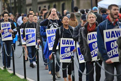 In this April 30, 2018 file photo, striking teaching assistants protest on the Columbia University campus in New York. Image credit: AP Photo/Bebeto Matthews