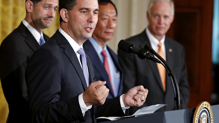 In this July 26, 2017, file photo, Wisconsin Gov. Scott Walker speaks in the East Room accompanied by House Speaker Paul Ryan of Wisconsin, left, Foxconn CEO and founder Terry Gou, and Sen. Ron Johnson, R-Wis., at the White House in Washington. Image credit: AP Photo/Carolyn Kaster, File