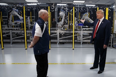 President Donald Trump tours a Foxconn facility, Thursday, June 28, 2018, in Mt. Pleasant, Wis. Image credit: AP Photo/Evan Vucci