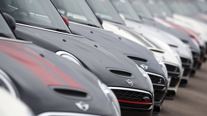 In this May 7, 2018, file photo, a long line of 2018 and 2019 Cooper Countryman and Clubman models sits at a Mini Cooper dealership in Highlands Ranch, Colo. Image credit: AP Photo/David Zalubowski, File