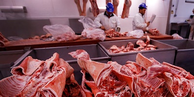 FILE - In this file photo taken on Monday, July 18, 2016, butchers prepare cuts of meat at Smithfield Market, in London. A shortage of carbon dioxide in Europe is hitting food processing companies who rely on the gas to stun animals before slaughter, as it is announced Tuesday June 26, 2018, that some meat processing plants will run out of CO2 within days. (AP Photo/Kirsty Wigglesworth, FILE)