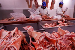 FILE - In this file photo taken on Monday, July 18, 2016, butchers prepare cuts of meat at Smithfield Market, in London. A shortage of carbon dioxide in Europe is hitting food processing companies who rely on the gas to stun animals before slaughter, as it is announced Tuesday June 26, 2018, that some meat processing plants will run out of CO2 within days. (AP Photo/Kirsty Wigglesworth, FILE)