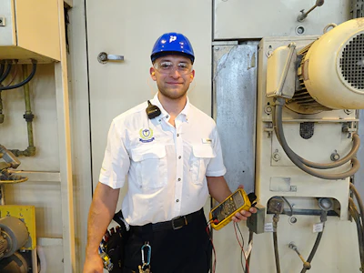 Timothy Gutierrez, an electrician at Inteplast BOPP Films, Lolita, TX, inspects a TDO heating system.