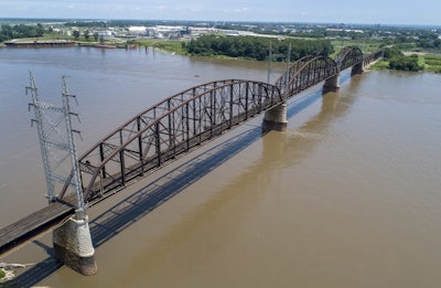 In this photo made Wednesday, June 27, 2018, the Merchants Bridge is seen in the foreground as it crosses the Mississippi River as the St. Louis skyline is seen in the distance. Image credit: AP Photo/Jeff Roberson