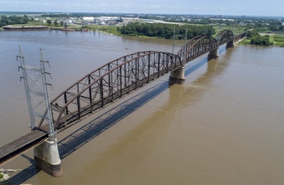 In this photo made Wednesday, June 27, 2018, the Merchants Bridge is seen in the foreground as it crosses the Mississippi River as the St. Louis skyline is seen in the distance. Image credit: AP Photo/Jeff Roberson