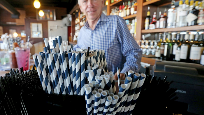 In this June 19, 2018 photo, paper straws sit at Duke Moscrip, owner of Duke's Restaurants, bar at his restaurant in Seattle. Image credit: Greg Gilbert/The Seattle Times via AP