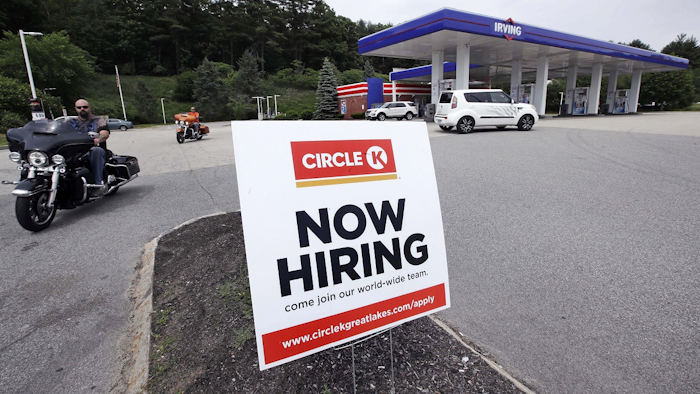 In this June 20, 2018, photo, a 'Now Hiring' sign is posted outside a gas station in Raymond, N.H. Image credit: AP Photo/Charles Krupa