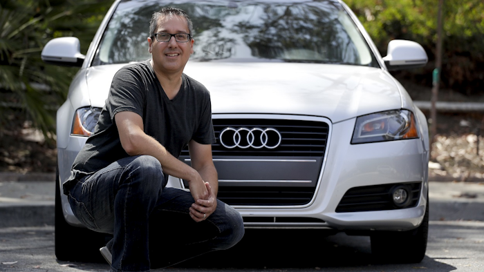 Keith Reynolds, who is on the Tesla waiting list for a Model 3, is photographed by his 9-year-old Audi A3 compact car Monday, July 16, 2018, in Laguna Hills, Calif. Image credit: AP Photo/Chris Carlson