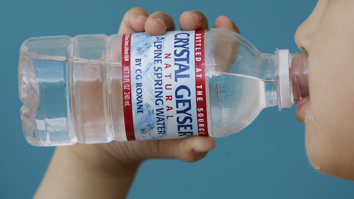 In this May 3, 2008, file photo, a child drinks from a Crystal Geyser water bottle in Palo Alto, Calif. Image credit: AP Photo/Paul Sakuma, File