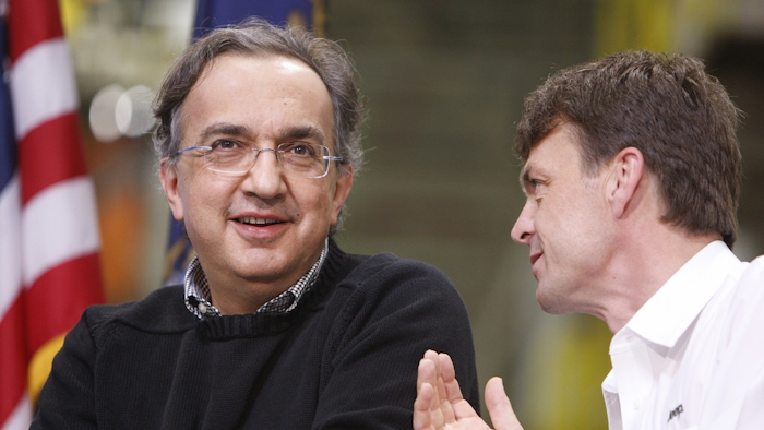 In this Friday, May 21, 2010 file photo, Chrylser CEO Sergio Marchionne, left, is seen with Jeep brand President and CEO Mike Manley at the Jefferson North Assembly Plant, in Detroit. Image credit: AP Photo/Carlos Osorio, File