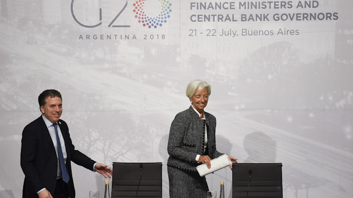 Christine Lagarde, right, International Monetary Fund Managing Director and Argentina Treasury Minister Nicolas Dujovne arrives for a press conference during the G20 meeting of Finance Ministers and Central Bank governors in Buenos Aires, Argentina, Saturday, July 21, 2018. Image credit: AP Photo/Gustavo Garello