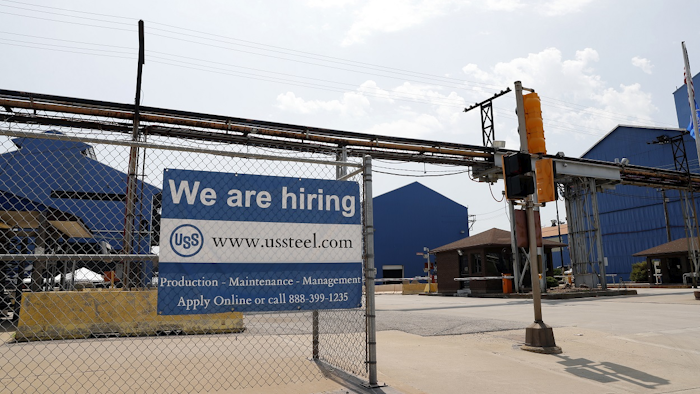In this June 28, 2018 photo, a help wanted sign hangs outside the U.S. Steel Granite City Works facility in Granite City, Ill. Image credit: AP Photo/Jeff Roberson