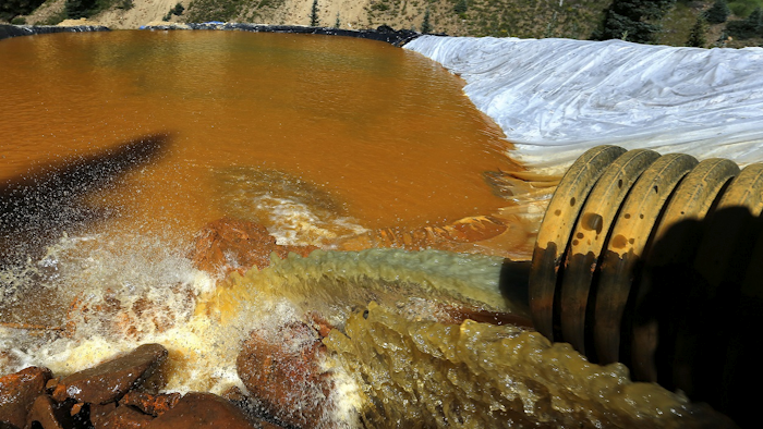 In this Aug. 14, 2015 file photo, water flows through a series of sediment retention ponds built to reduce heavy metal and chemical contaminants from the Gold King Mine wastewater accident outside Silverton, Colo. Image credit: AP Photo/Brennan Linsley, File