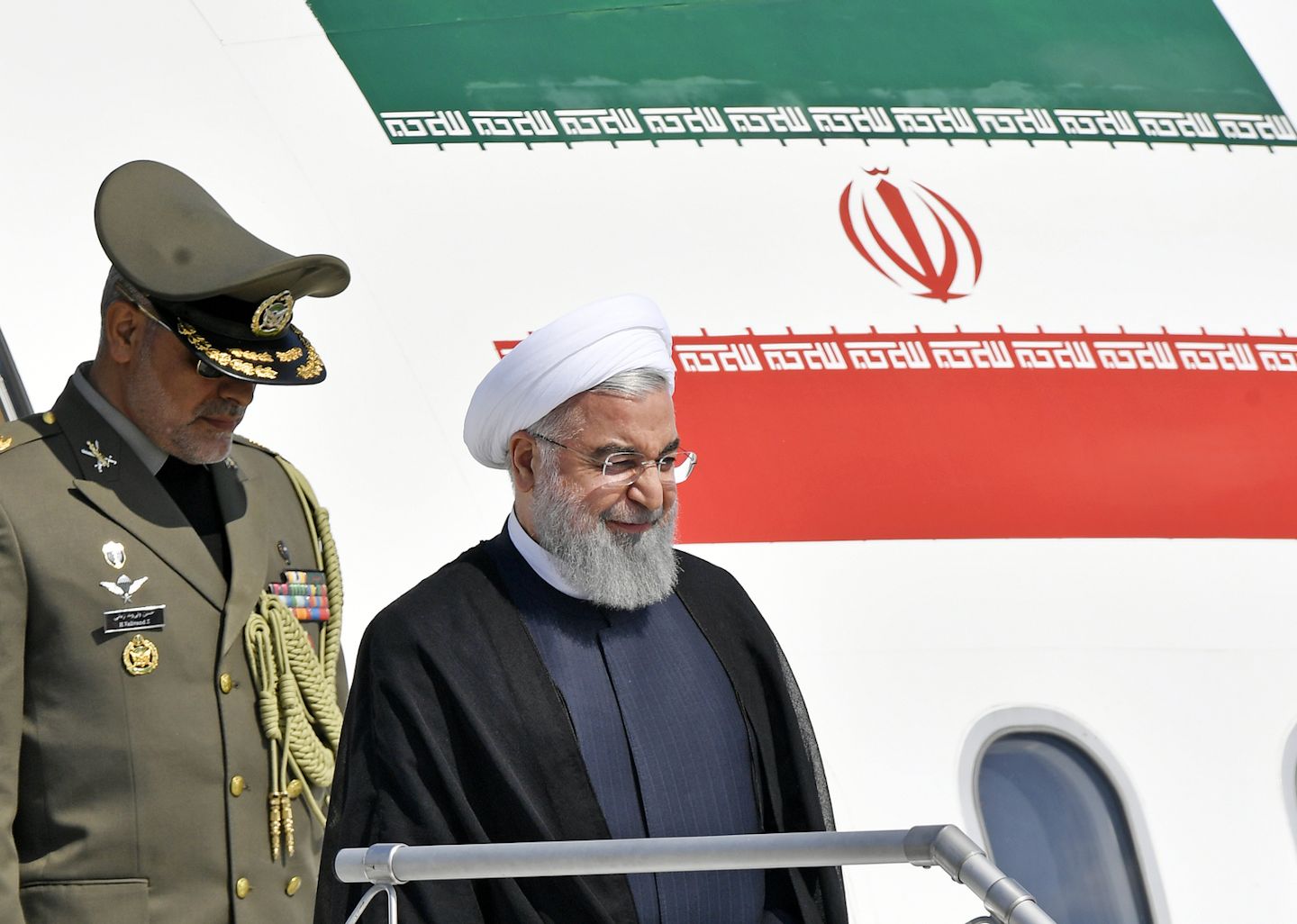 Iranian President Hassan Rouhani, right, arrives at the Zurich airport, in Kloten, Switzerland. Monday, July 2, 2018. Hassan Rouhani is on a two day state visit to Switzerland. (KEYSTONE/Walter Bieri)