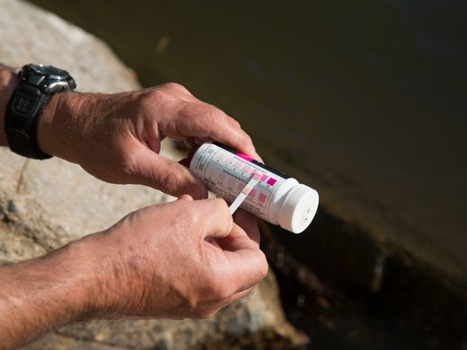 Retired environmental science teacher Ray Harden tests nitrate levels in the Raccoon River on Saturday, May 21, 2016. (Zach Boyden-Holmes/The Des Moines Register)