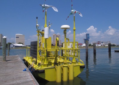 This photo shows a research buoy in Atlantic City, N.J., July 16, 2018, before it was to be positioned 10 miles off the coast as part of preparations for an offshore wind turbine field to generate electricity. (AP Photo/Wayne Parry)