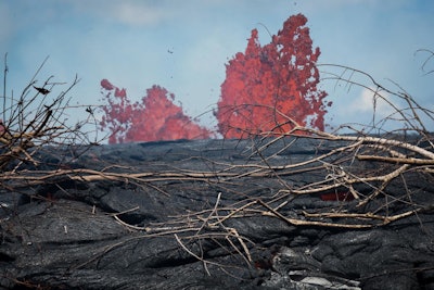 Fissure 21 of the Kilauea volcano erupts in the Leilani Estates subdivision of Pahoa, Hawaii, on May 22. The gases released after a volcanic eruption can enter the upper atmosphere and sometimes cause the cooling of the Earth. (Ronit Fahl/Getty Images)