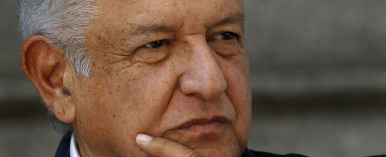 In this Sunday, July 22, 2018 photo, Mexico's President-elect Andres Manuel Lopez Obrador listens to a reporter's question outside his party's headquarters, in Mexico City. Lopez Obrador announced a $16 billion investment plan Friday, July 27, 2018, to boost flagging oil production, refinery capacity and electrical generation. (AP Photo/Marco Ugarte)