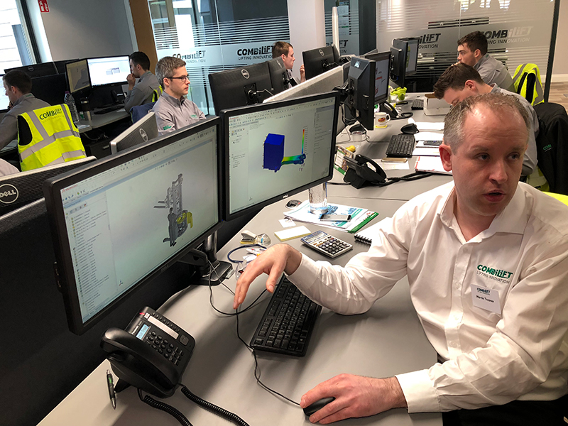 Combilift head of engineering, Martin Treanor, explains the design process to North American journalists. (IMPO photo)